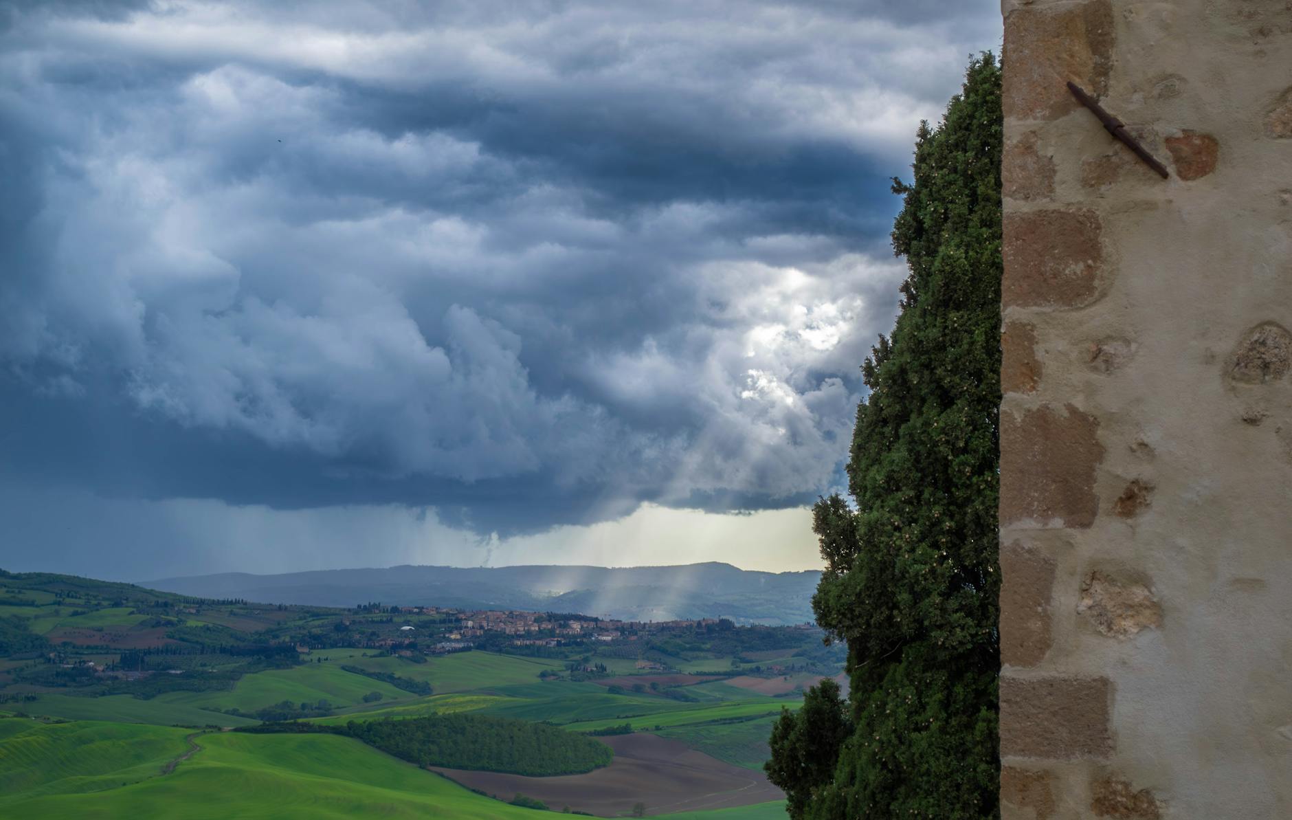 dramatic tuscan landscape with storm clouds