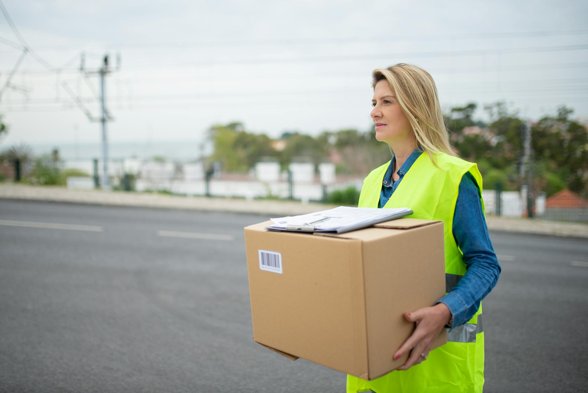 a woman carrying a box